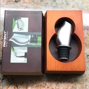 Patent wine stopper.  Small divot on top.